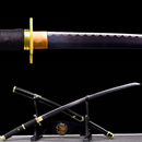 Close-up of black katana with wavy edge and golden guard on display stand with dragon motif; Yubashiri Zoro Katana.