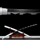 Black and silver Katana with jagged blade displayed on a wooden stand, white scabbard beneath. "Inosuke Katana" from Manga Katana collect...