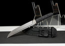 Stealth Hawk Short Sword — Titanium Edition — black textured grip, gold collar, black molded sheath with clip
